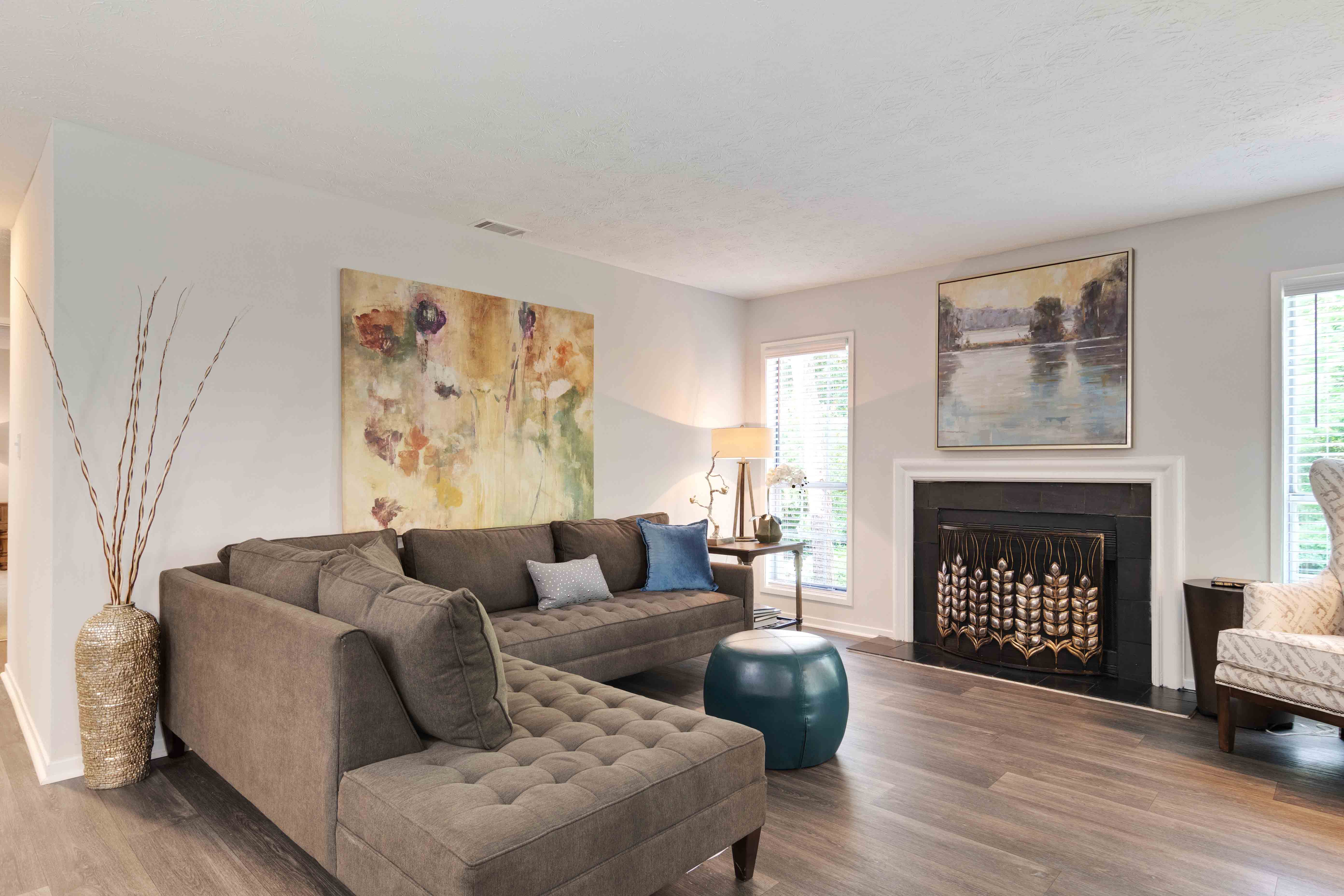 a living room with a couch and a fireplace